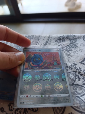 Japanese Pokemon TCG cards with 5 card stands