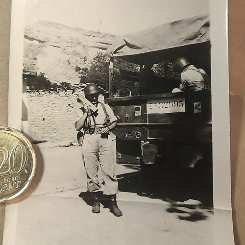 Vintage military photo used, Greek soldier with radio and truck