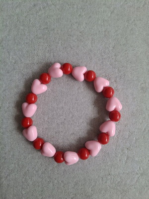 Handmade bracelet with red and pink heart beads made to order