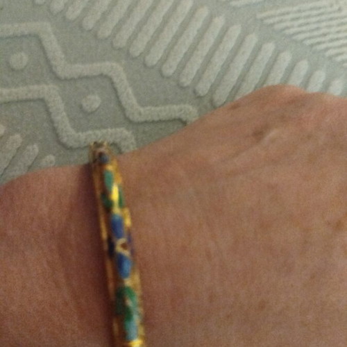 Metal bracelet with unique colorful designs like new
