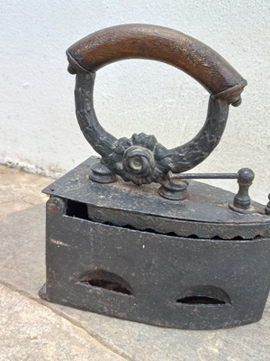 Karavaki Charcoal Iron used with ornate handle design