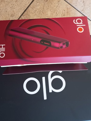 Glo electronic device with charging cable and cleaning brush