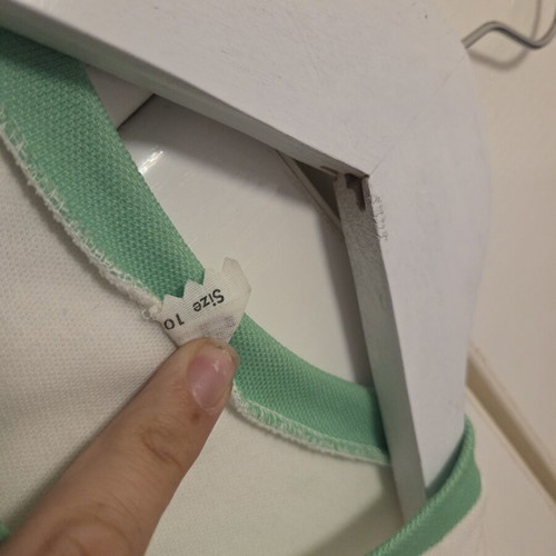 White blouse with green details, like new