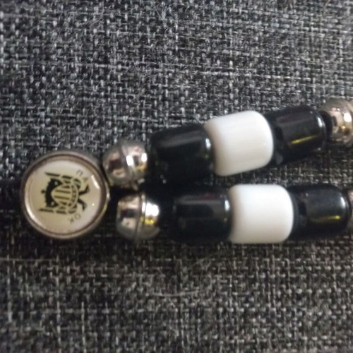 PAOK Komboloi like new, black and white with metal emblem