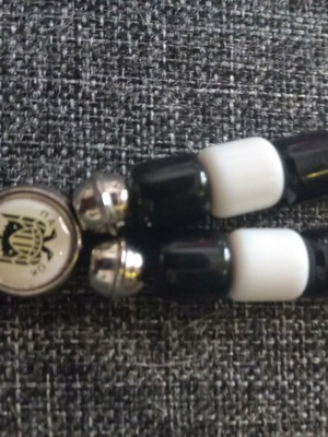 PAOK Komboloi like new, black and white with metal emblem
