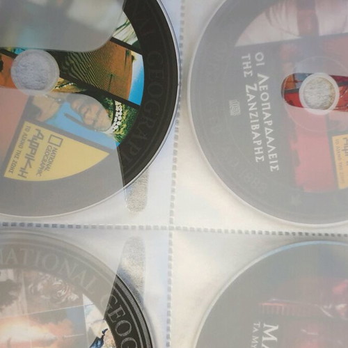 Discovery National Geographic DVD new, pack of 128 in album case