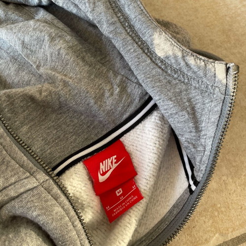 Nike jacket used gray with gold details and small defects