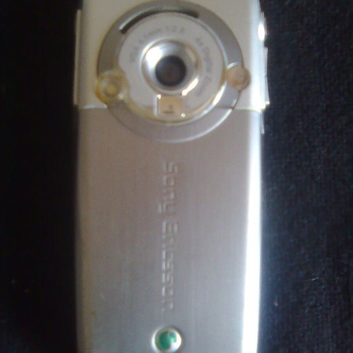 Sony Ericsson K700i used mobile phone with charger and headphones