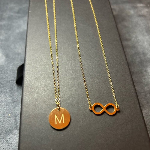 Set of 2 pendants letter M and infinity symbol gold color, new