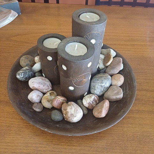 Decorative table set with stones and candles, new