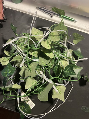 LED string lights with artificial leaves