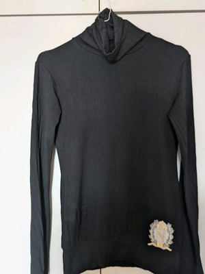 Pink Woman black turtleneck with open back, size M, used