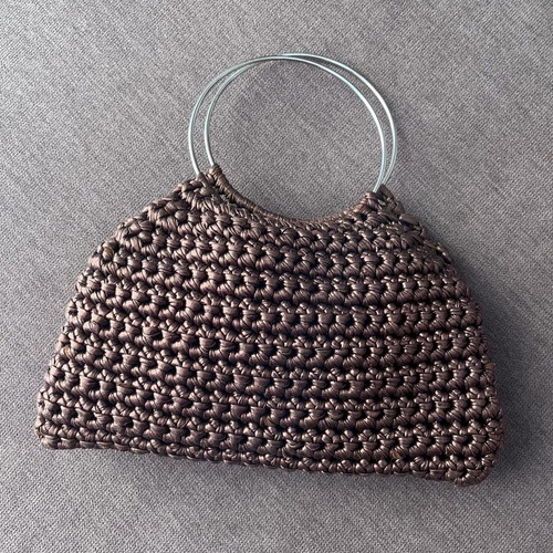 Brown metallic knitted handbag with silver ring handles