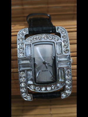Women's watch used with rectangular dial and crystals