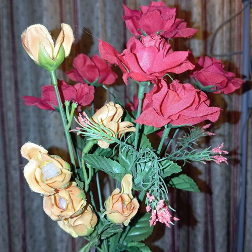 Bouquet of red artificial roses like new for decoration