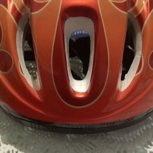 Children's helmet for bike and scooter used, medium size, red with orange flames