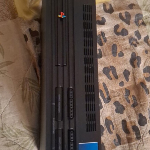Sony PlayStation 2 console with 2 controllers, memory card and 5 games