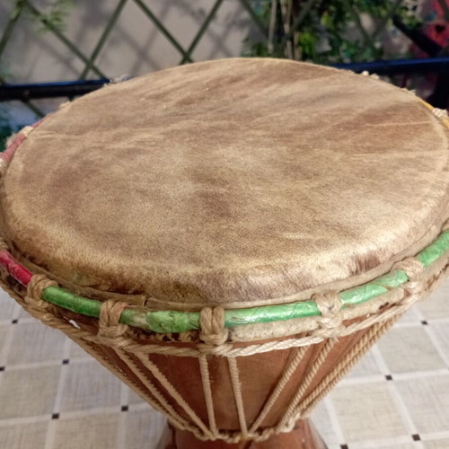 Traditional African djembe drum, carved wood and natural skin