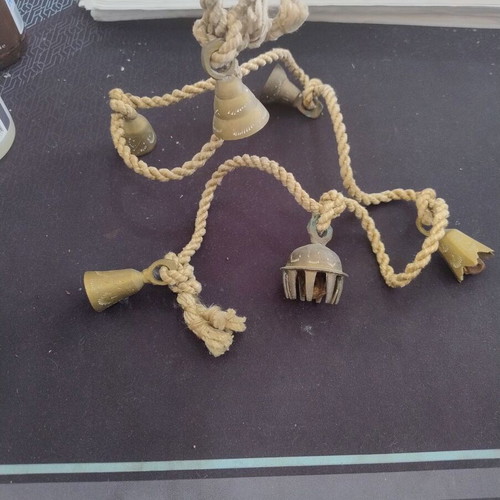 Vintage brass bells tied on rope used