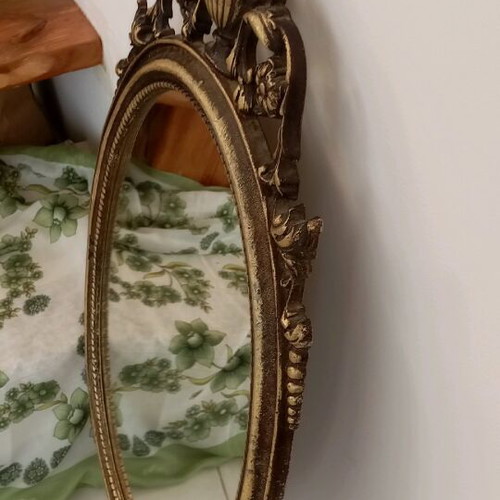 Oval bronze mirror used, antique style with gold paint