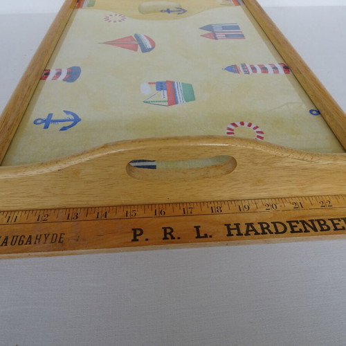 Vintage wooden breakfast tray with nautical theme used