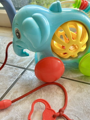 Elephant baby toy with rattle and wheels