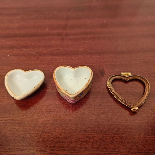 Decorative heart-shaped box used, broken with rust