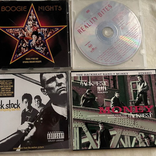 CDs with Boogie Nights, Lock Stock, Reality Bites movie soundtracks like new