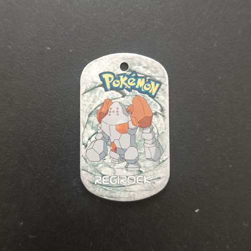 Regirock Pokemon metal tag 2006, slightly damaged