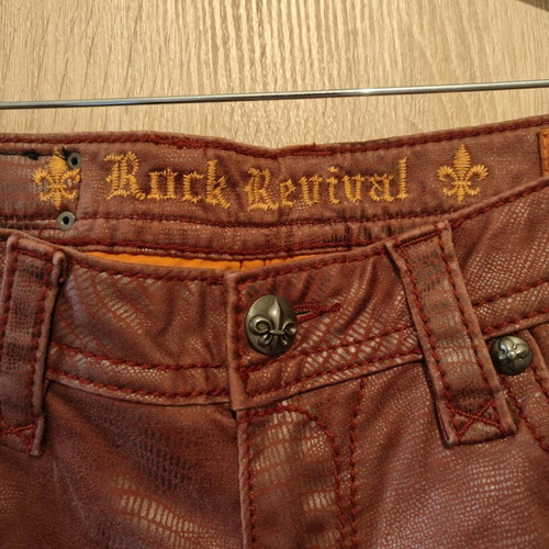 Rock Revival women's low rise red snake embossed denim jeans used