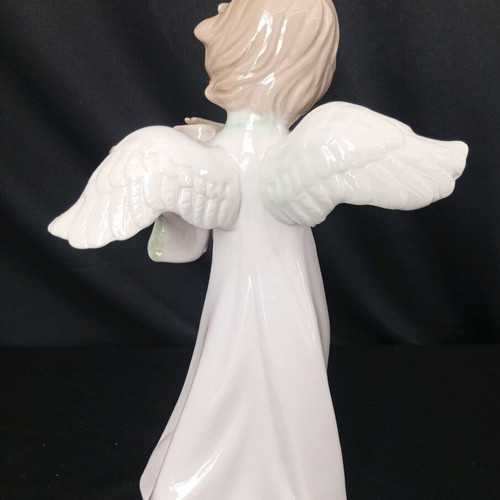 Porcelain angel figurine playing violin