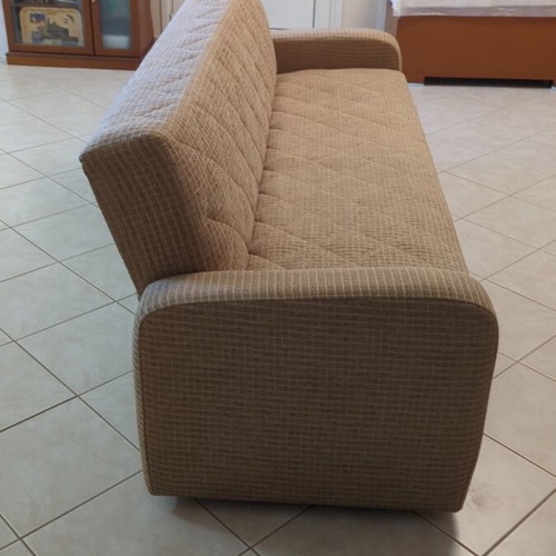 Practical three-seat sofa bed like new with storage compartments