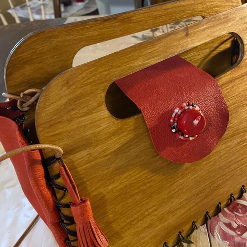 Wooden handmade bag with red leather stitched by hand