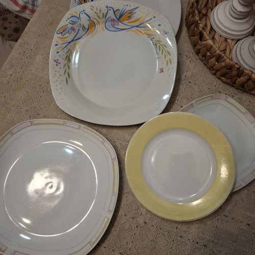 Cutlery set used, includes plates, forks, spoons, glasses, coffee cups