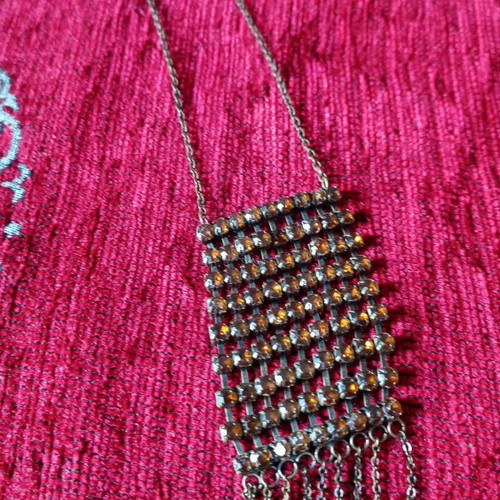 Alternative necklace used with rows of yellow crystals on antique bronze