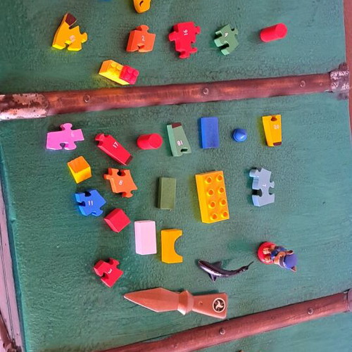Various puzzles used, assorted toys