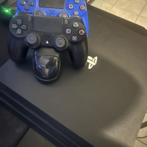 PlayStation 4 Pro 1TB with charging dock and 2 controllers like new