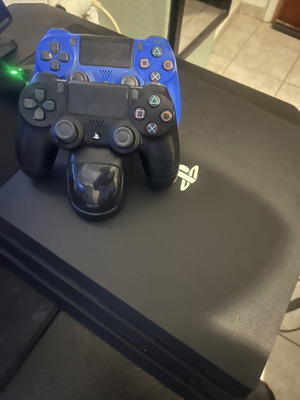 PlayStation 4 Pro 1TB with charging dock and 2 controllers like new