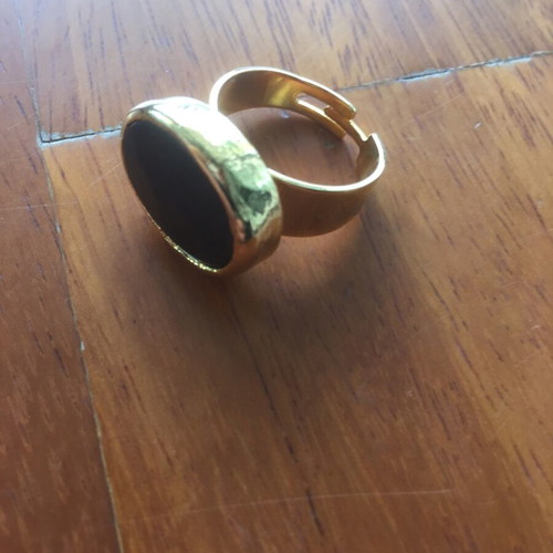 Faux ring like new, gold with black stone and adjustable size