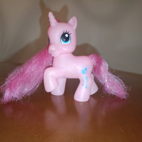 Pink My Little Pony Style Unicorn figure used with glitter hearts