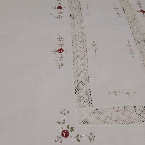 Embroidered tablecloth like new with satin ribbon and floral motifs