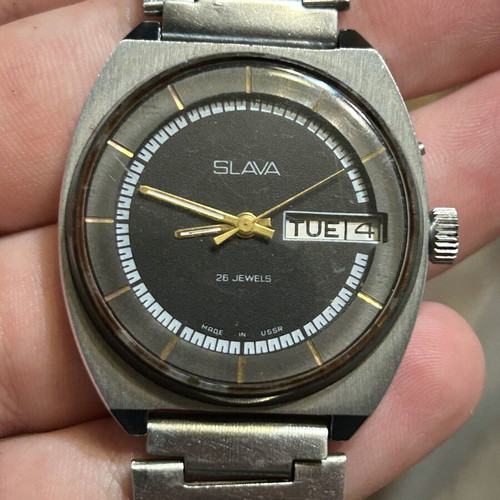 Slava mechanical wristwatch with 26 jewels like new, black and silver