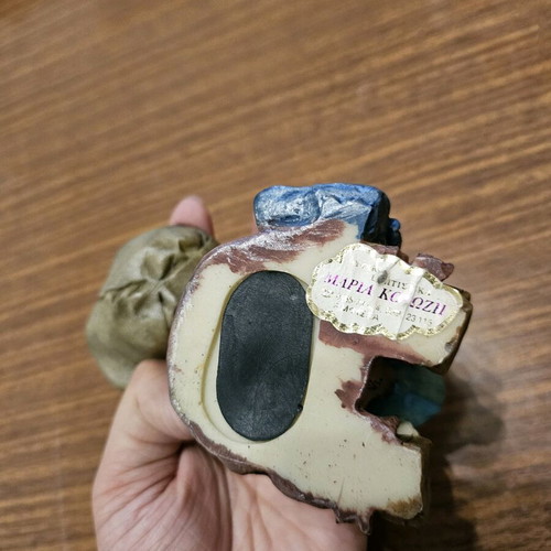 Decorative piggy bank child with book used