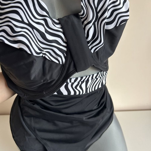 Two-piece swimsuit new, size 52, black and white