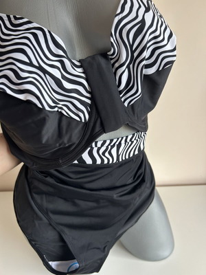 Two-piece swimsuit new, size 52, black and white