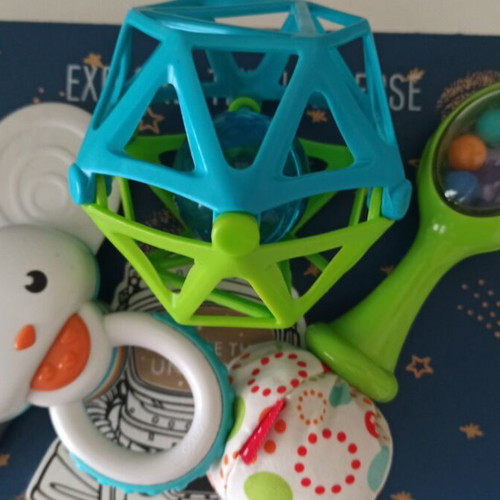 Gabesy ergonomic hip seat carrier used with branded baby toys