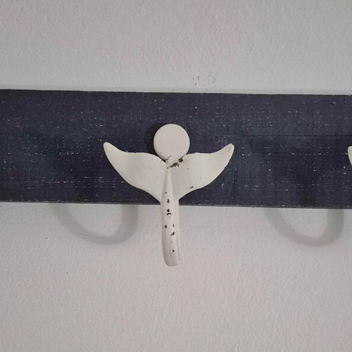 Wall hanger with 3 whale tails on blue wood like new