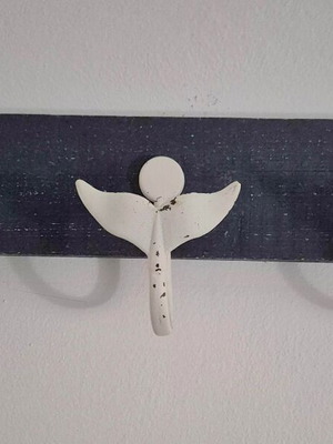 Wall hanger with 3 whale tails on blue wood like new