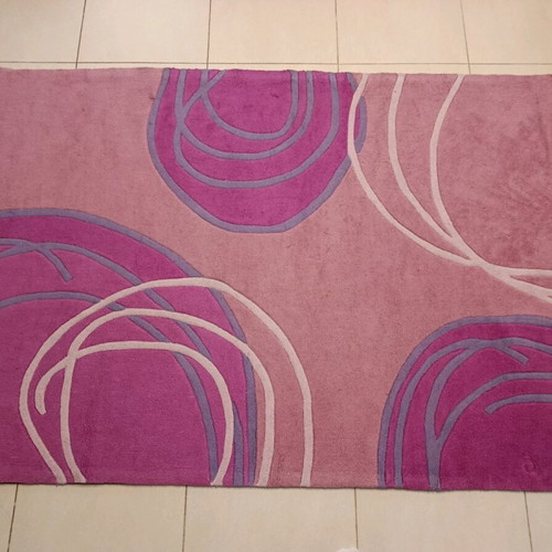 Children's rug used in pink fuchsia and purple with circular patterns