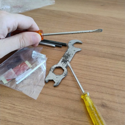 Various tools set used with 2 screwdrivers, 4 allen keys, screws and nails